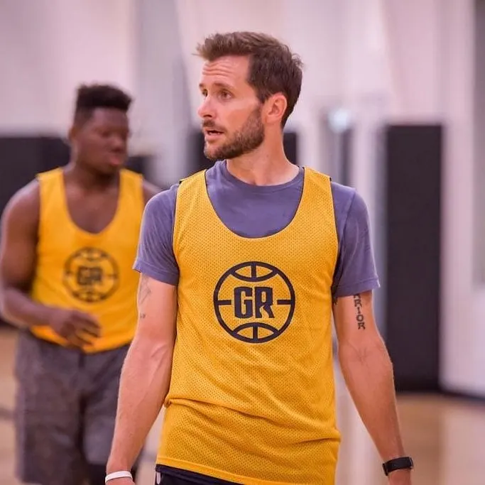Ryan on the court in a Grand Rapids pickup-basketball jersey
