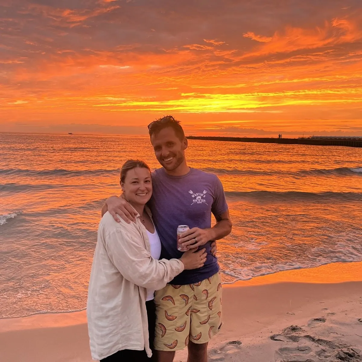 Ryan and Laura on the beach at sunset