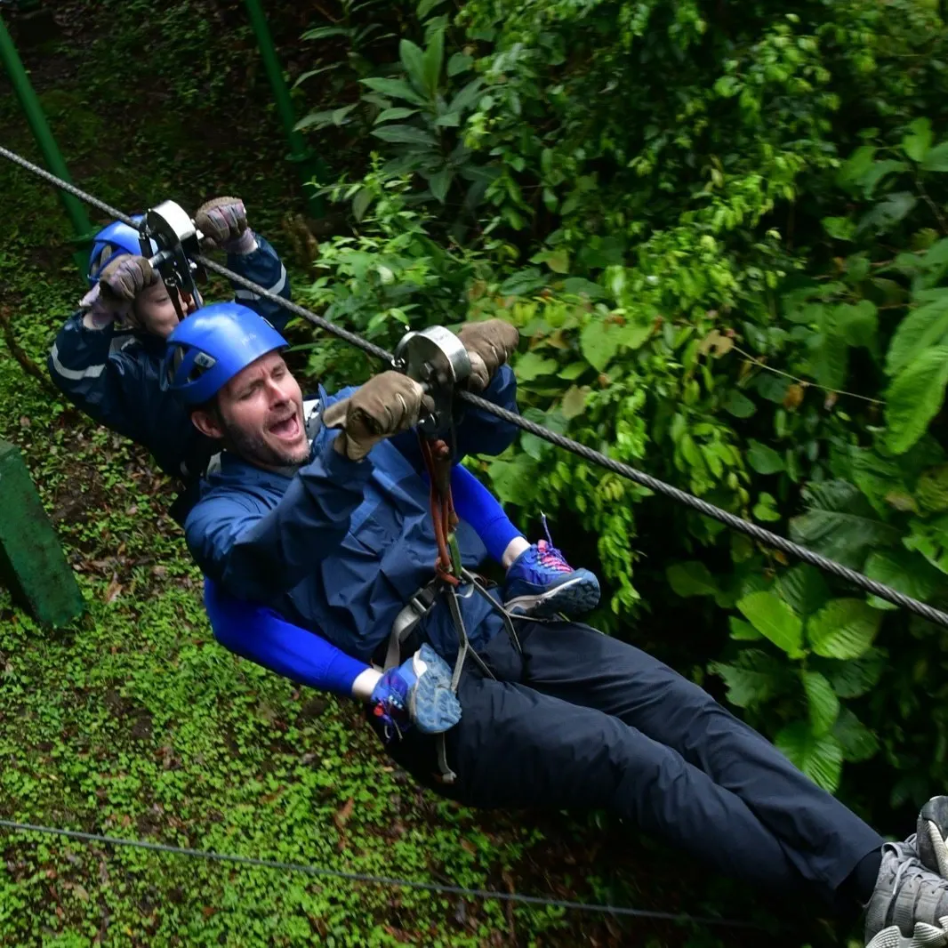 Ryan and one of his boys on a zipline through the jungle